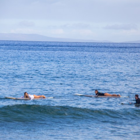 a group of people in a small boat in a body of water