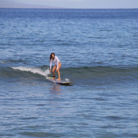 a man riding a wave on a surfboard in the ocean