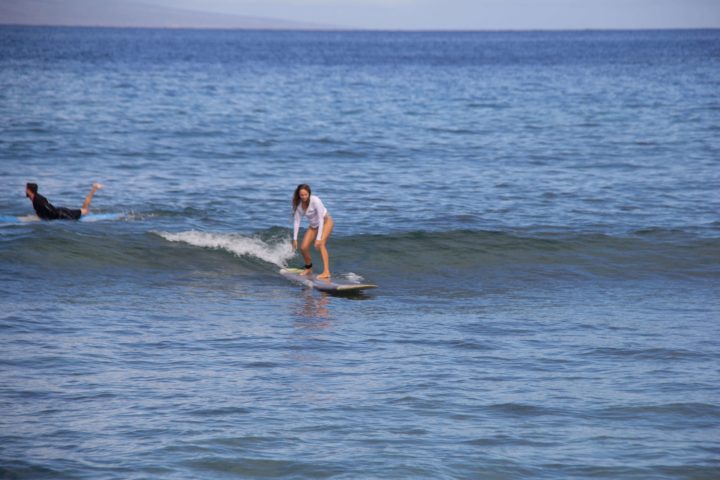 a man riding a wave on a surfboard in the ocean