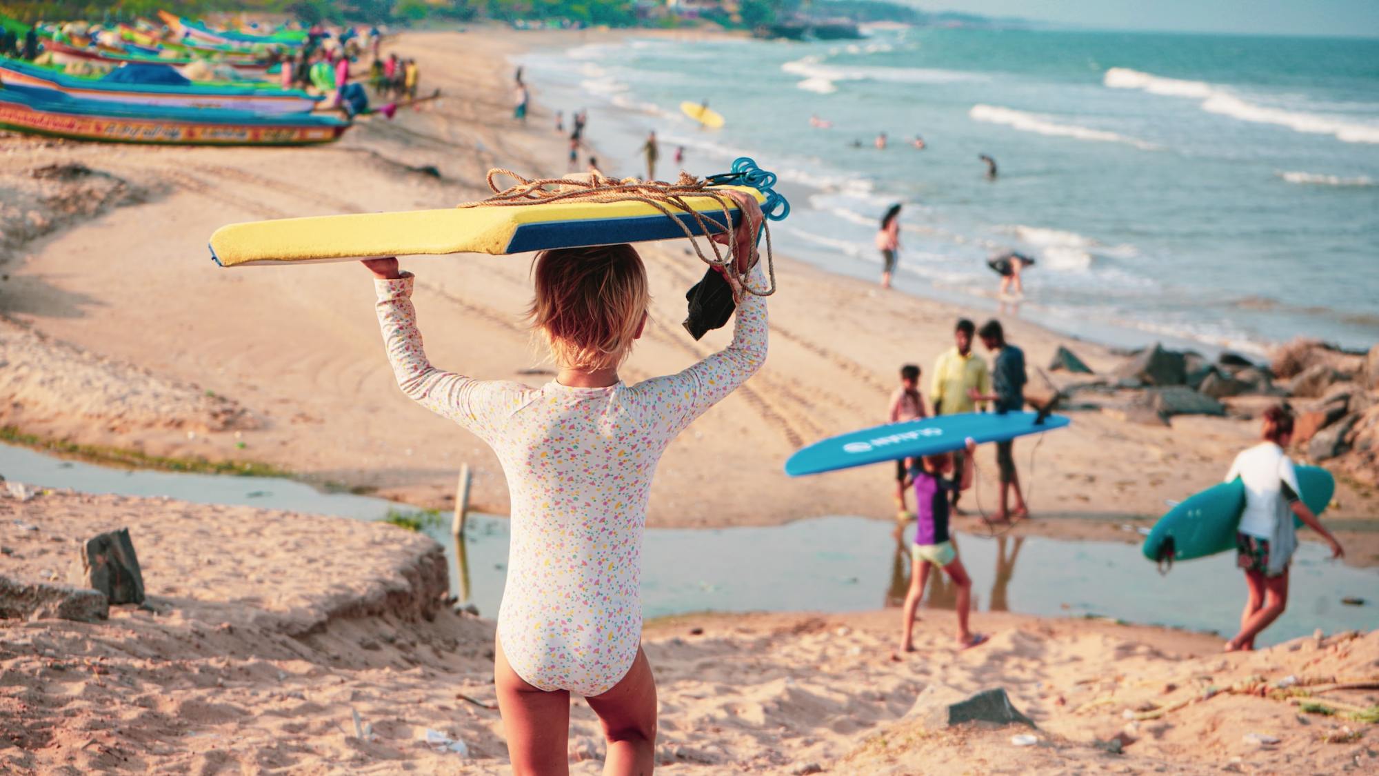 Keiki surf lessons Maui a group of people on a beach